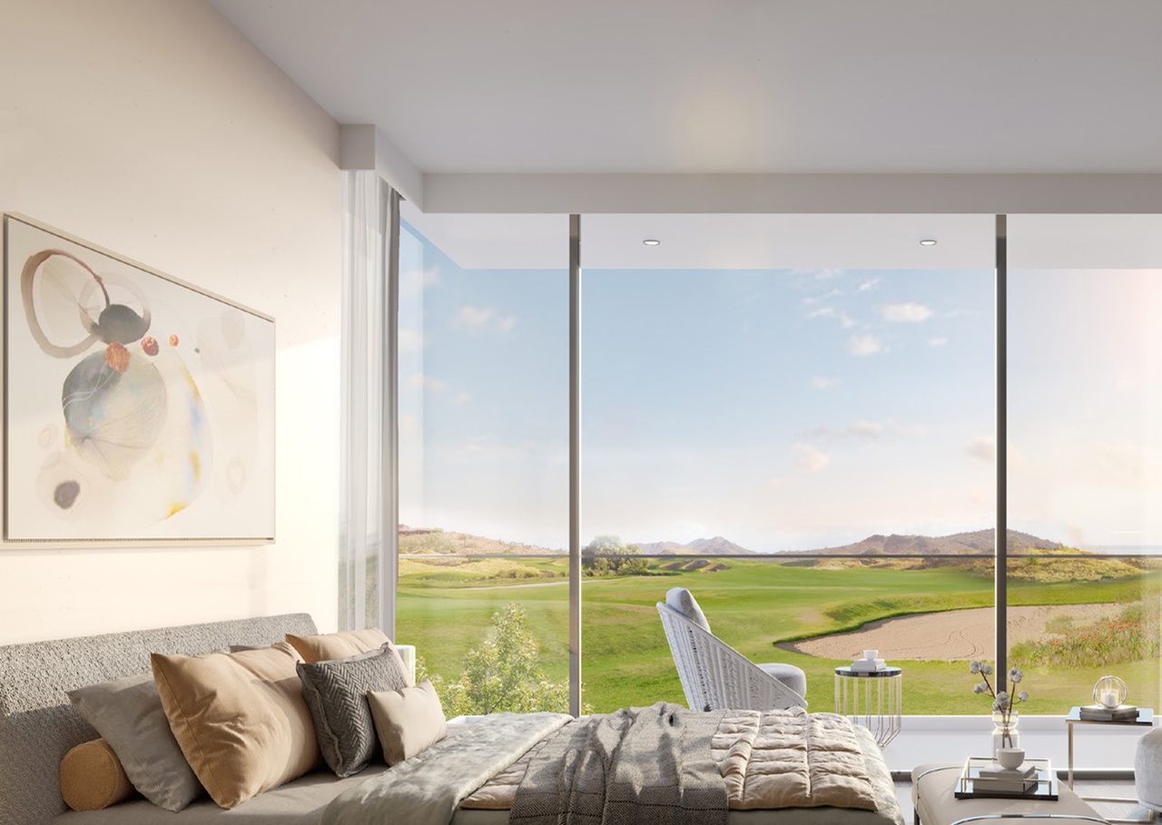 Bedroom with a large window over the golf course