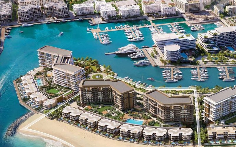 Aerial view of Azura Beach Residences between Al Mouj Marina and the beach